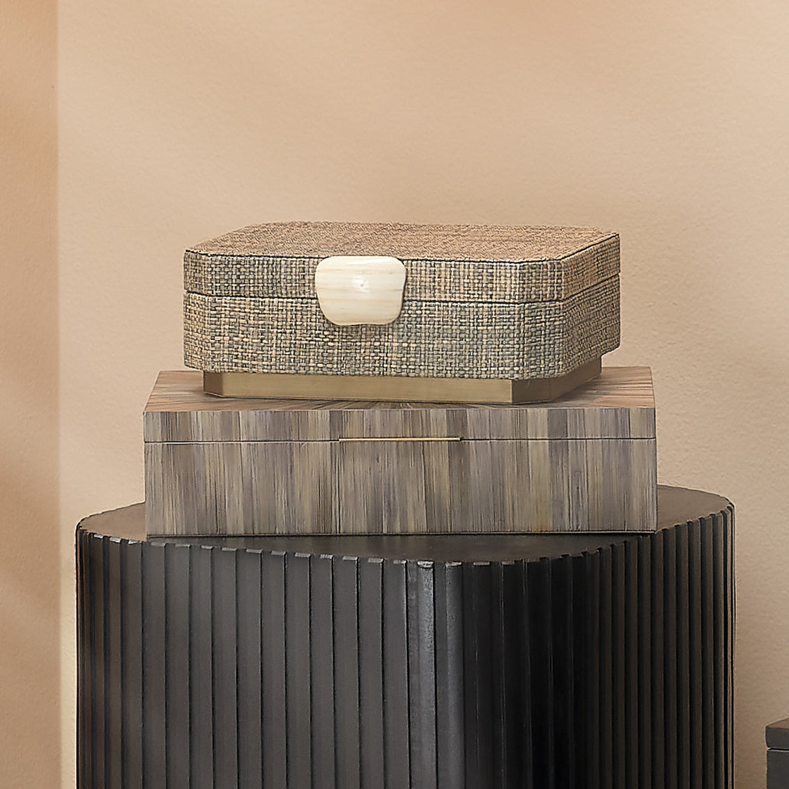 Woven storage box with a bone handle on a white background