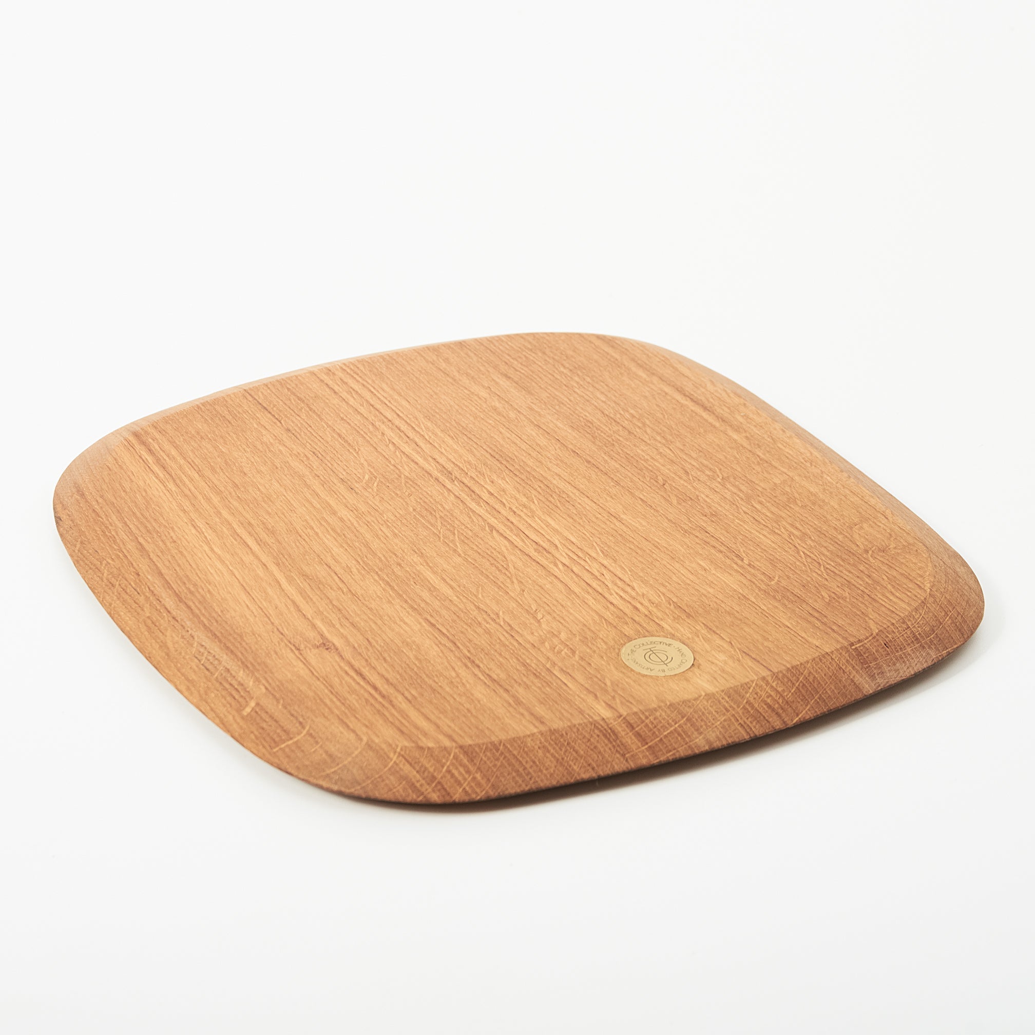 Wooden serving board with a brand logo on a white background