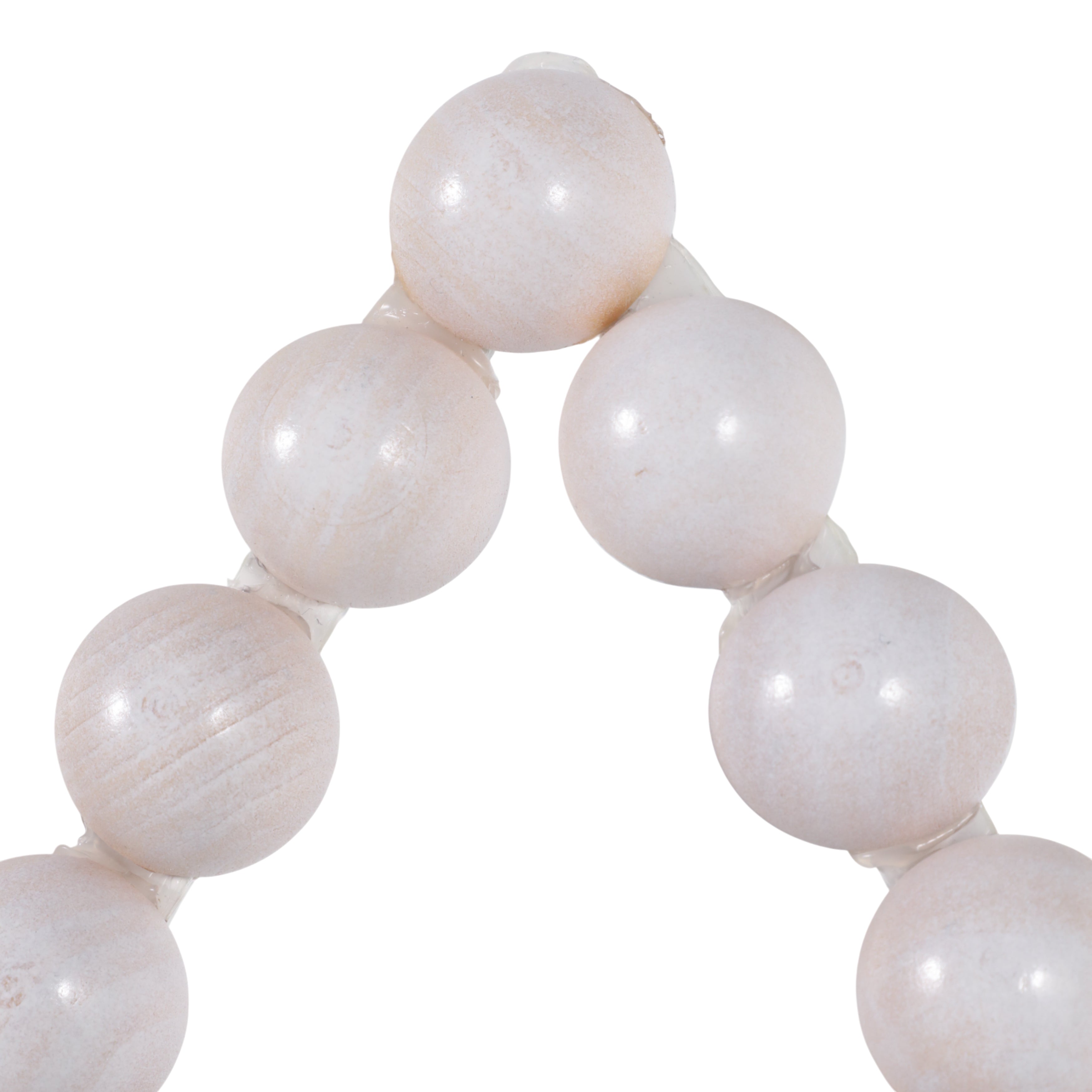 White stone beads on a white background