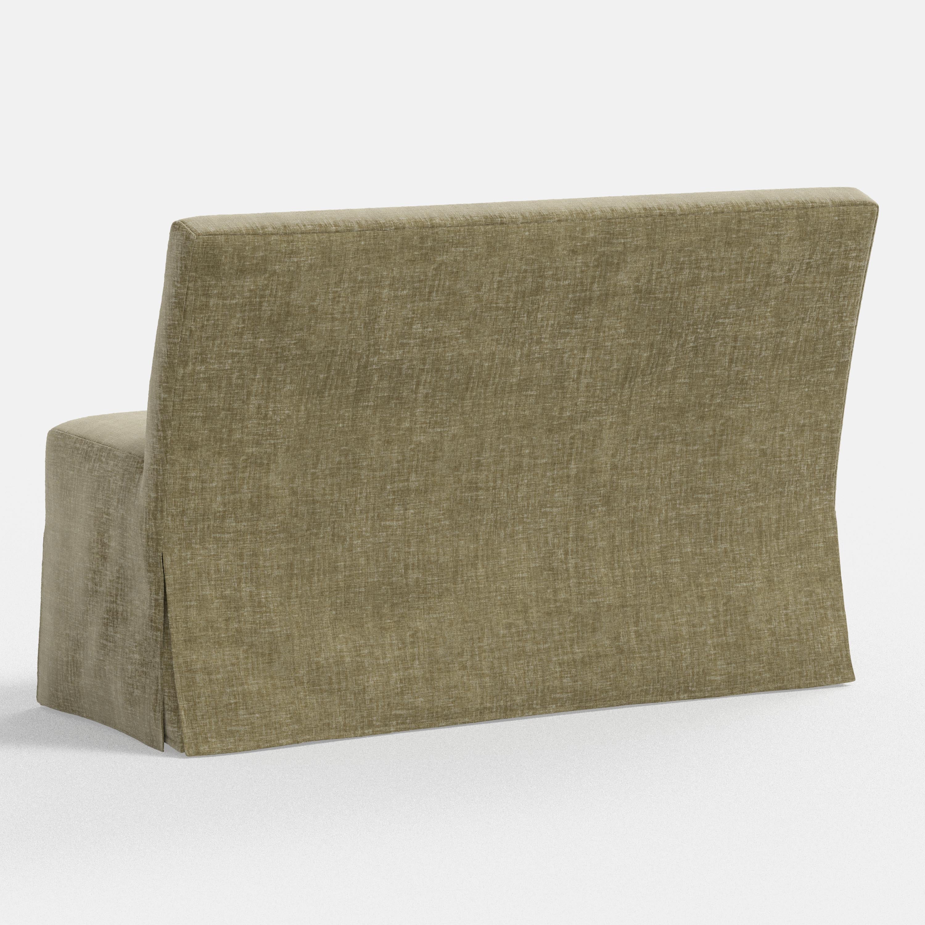 Green fabric bench with a headrest on a white background