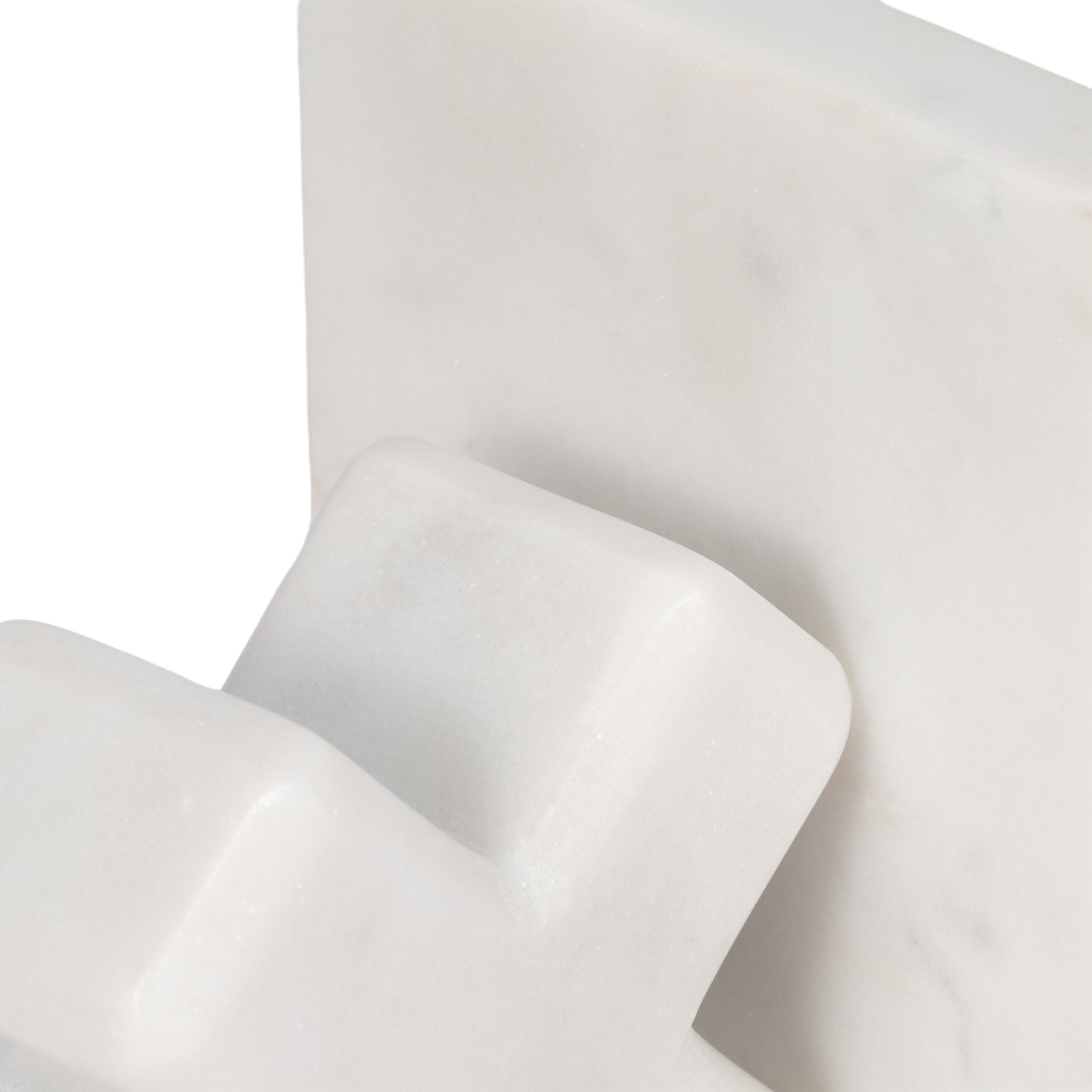 Close-up of white fabric with folds on a light gray background
