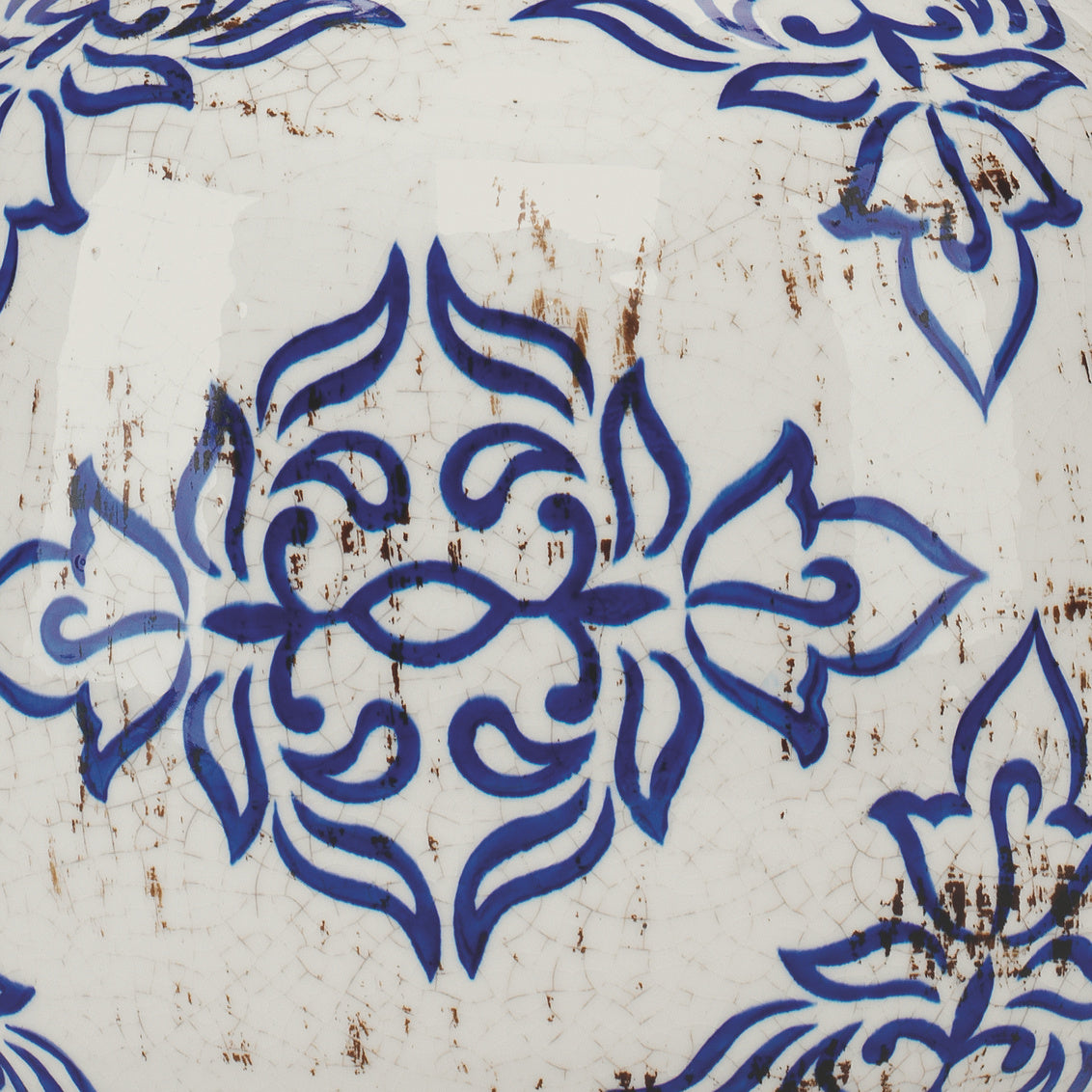 Blue floral pattern on a textured white background