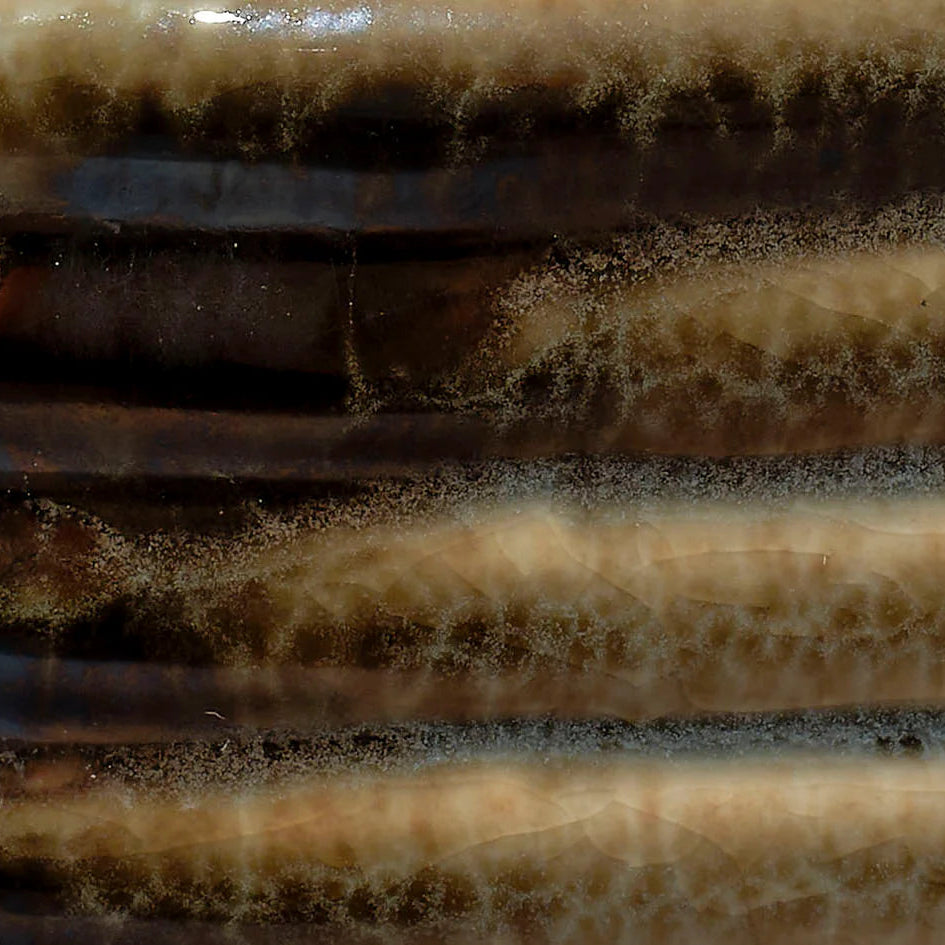 Close-up of a textured brown surface with ribbed pattern