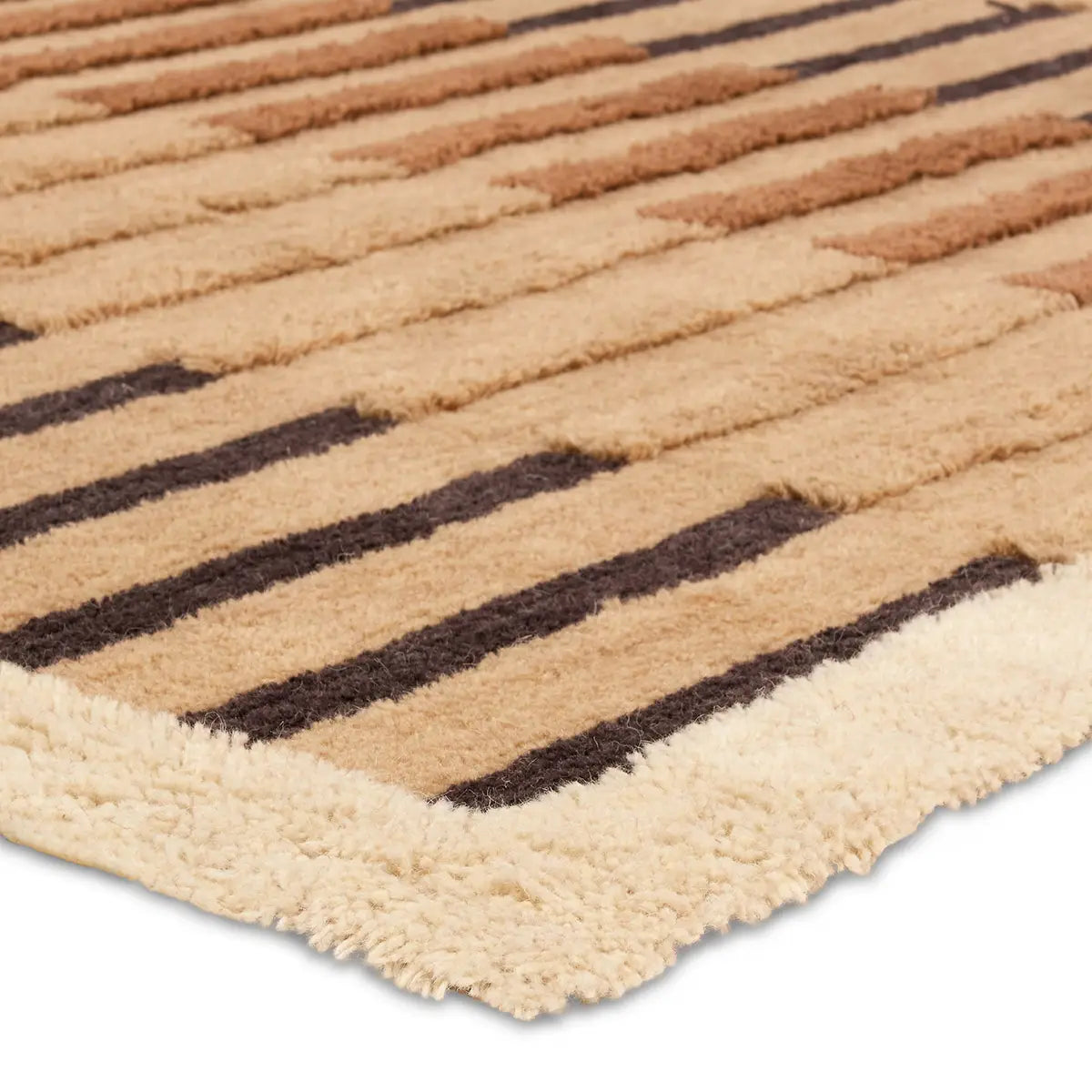 Close-up of a textured rug with brown and beige stripes on a white background