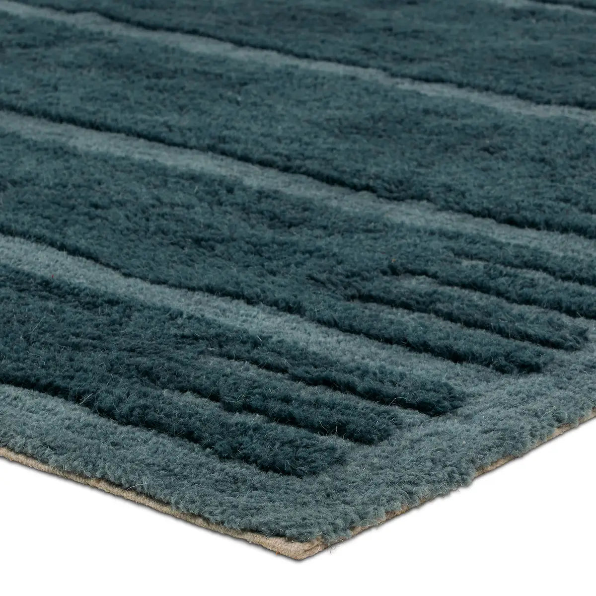 Textured teal rug with ribbed pattern on a white background