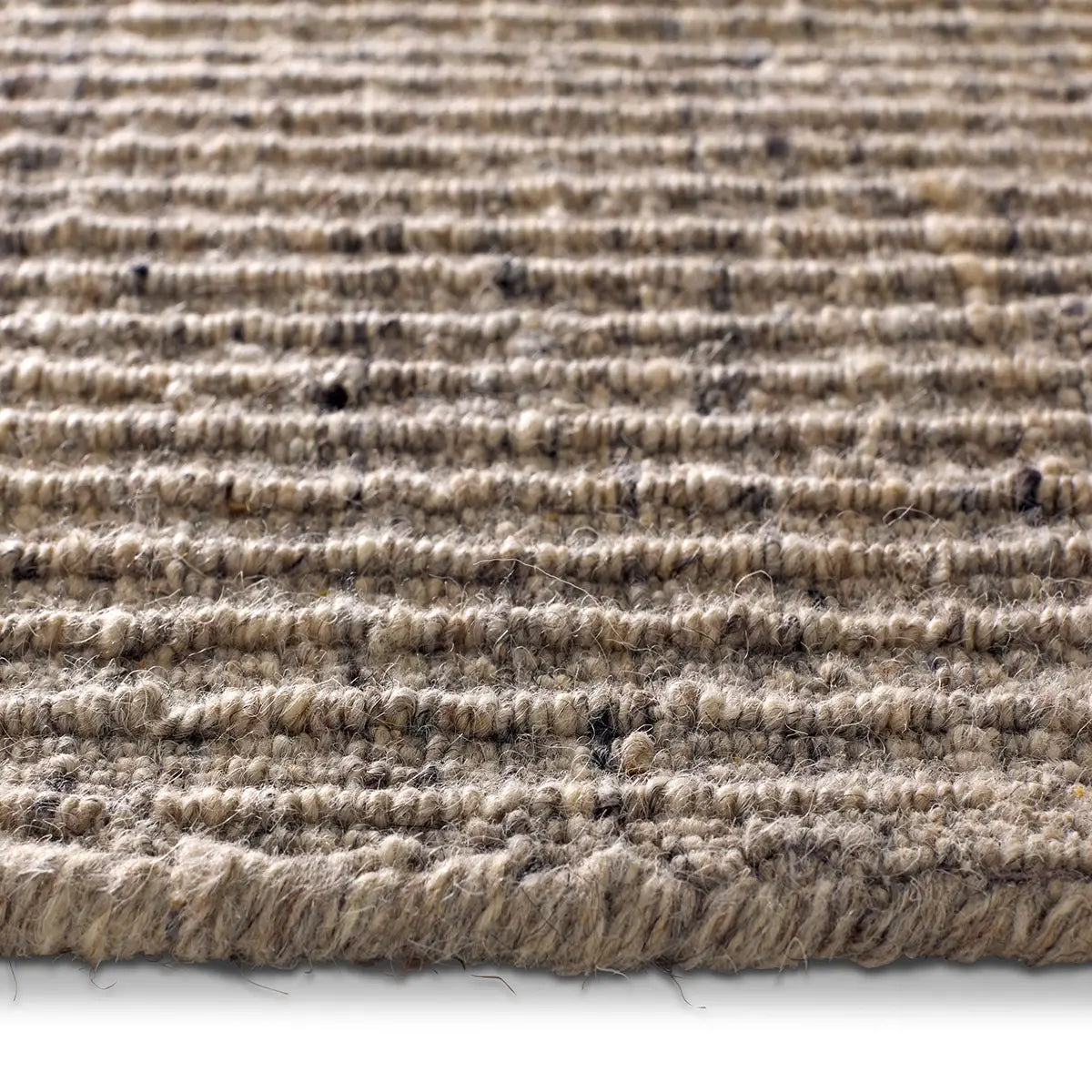 Close-up of a textured beige carpet