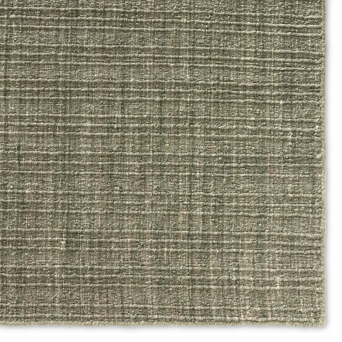 Textured green fabric swatch on a white background