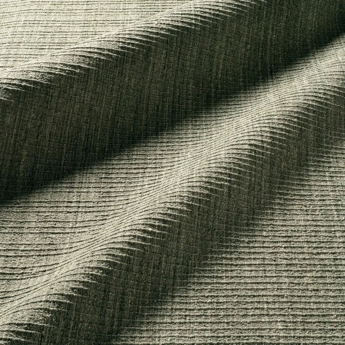 Close-up of textured green fabric with wavy pattern