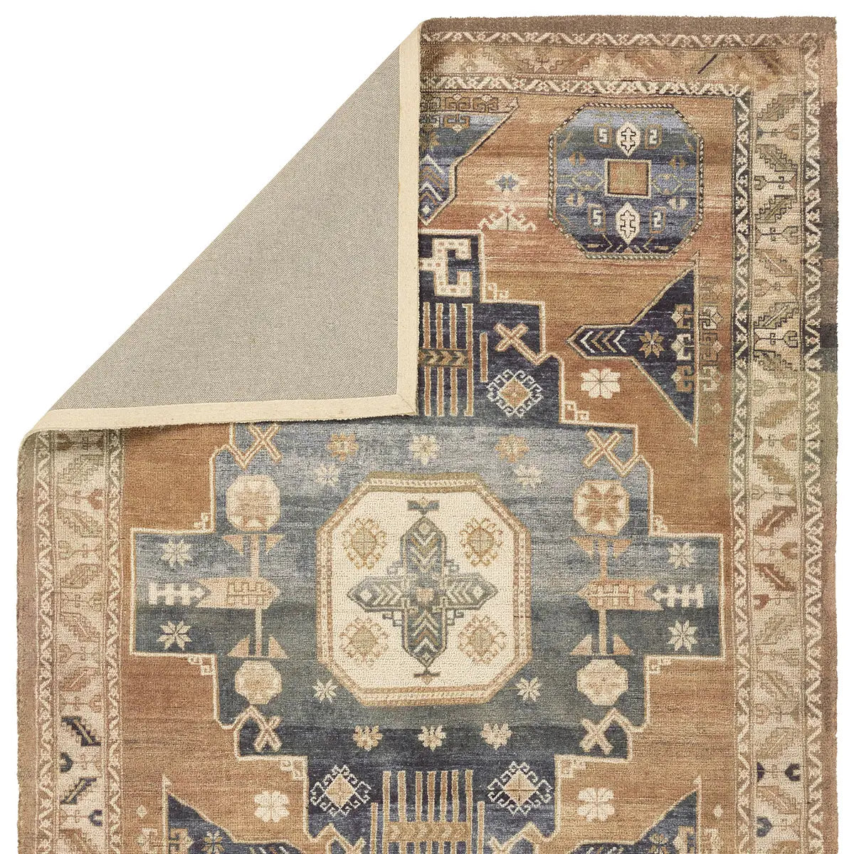 Patterned rug with geometric design on a white background