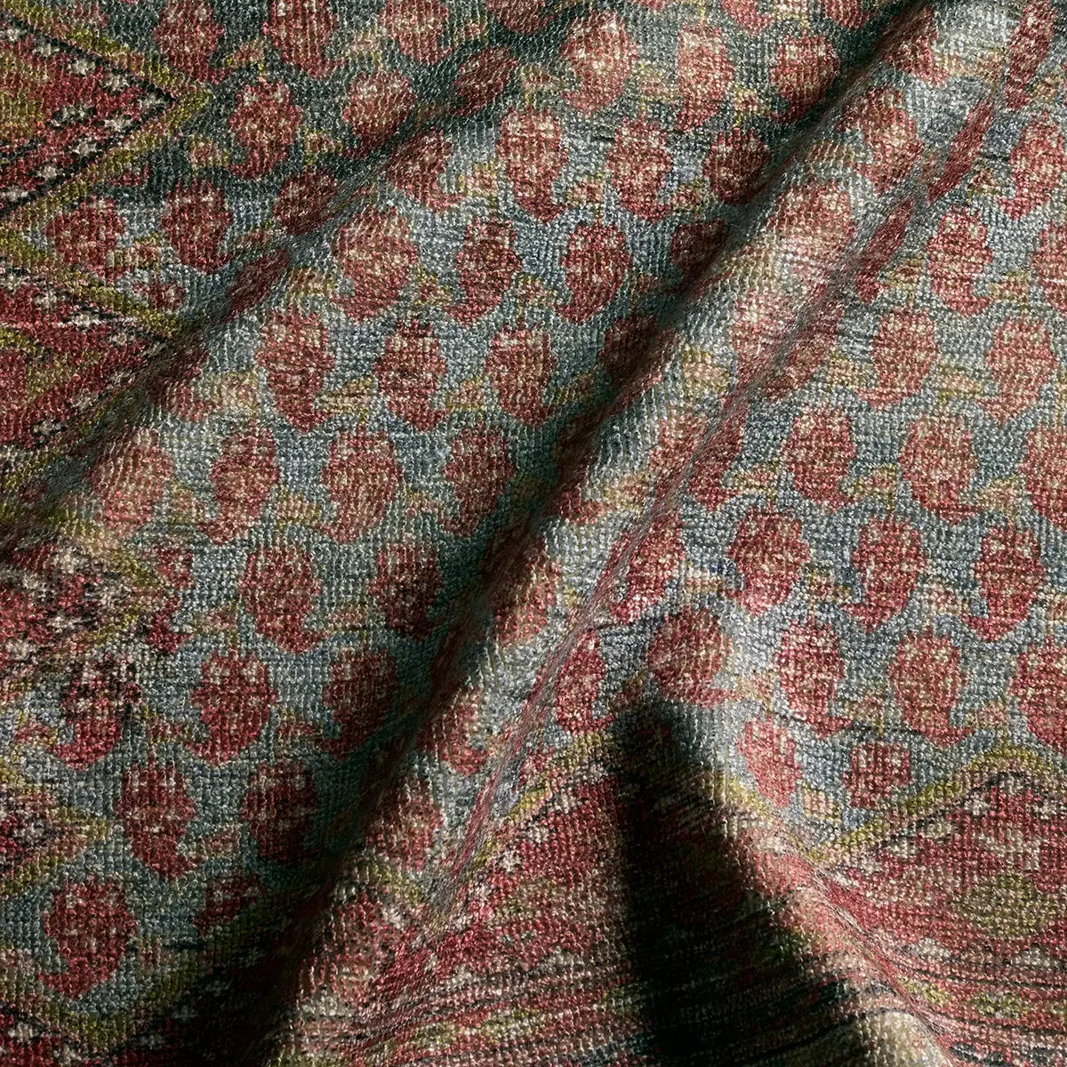 Close-up of patterned fabric with red and blue design