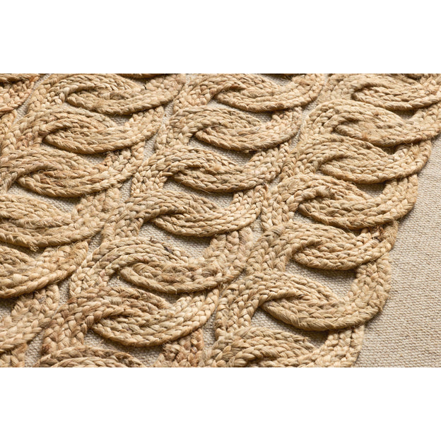 Close-up of a braided jute mat with a beige background