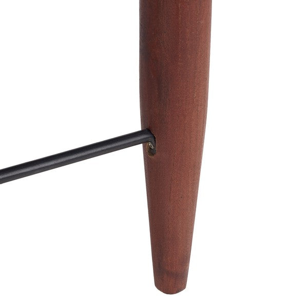 Close-up of a wooden leg with a metal bracket on a white background