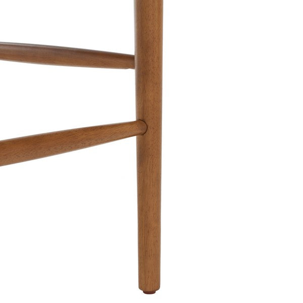 Close-up of a wooden chair leg on a white background