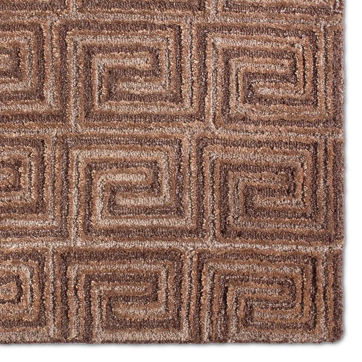 Close-up of a brown textured rug with geometric pattern