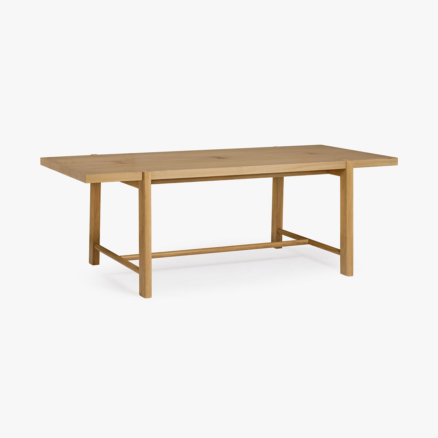 Wooden dining table on a white background