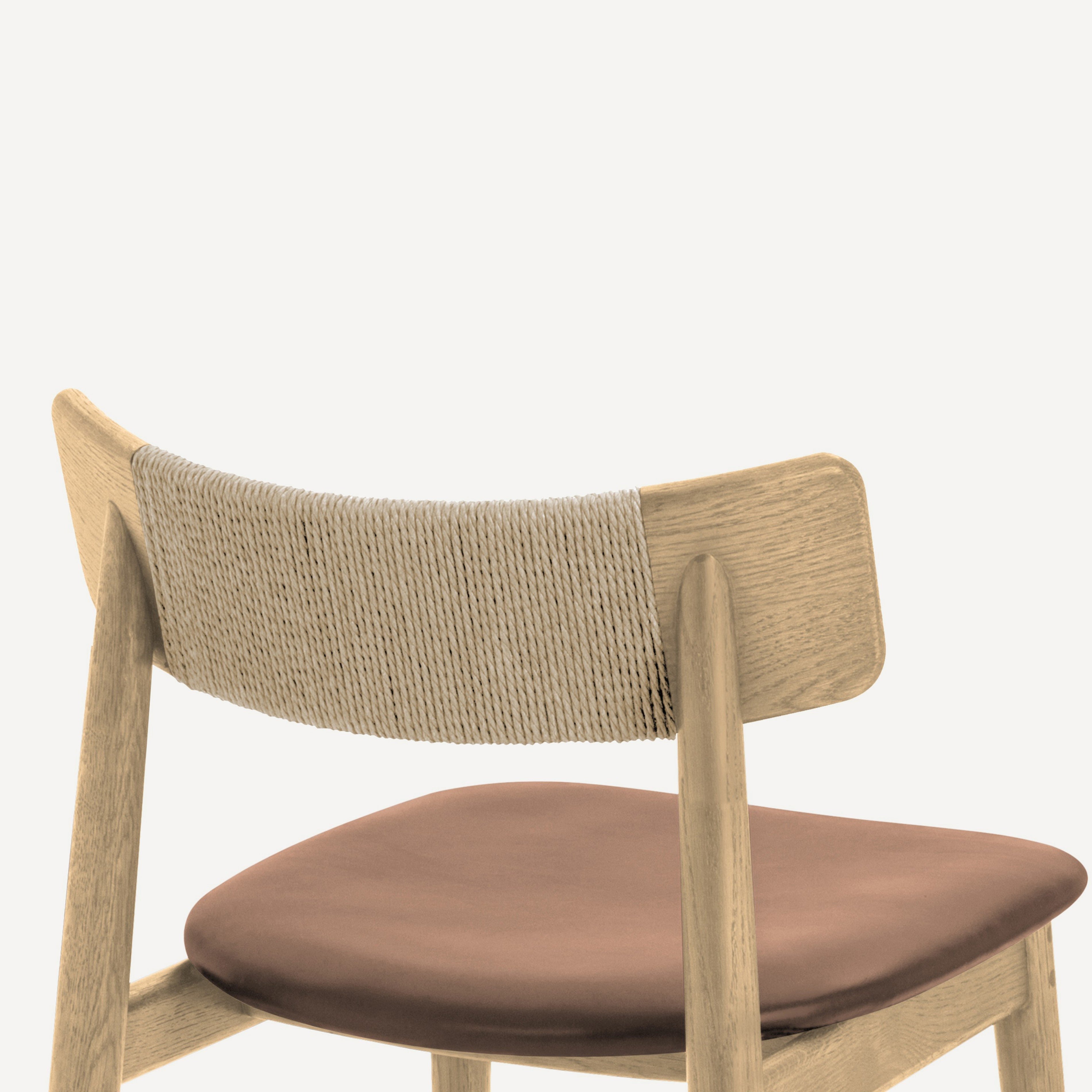 Close-up of the back of a wooden dining chair with a woven rope backrest and a brown upholstered seat cushion, shown against a plain white background.