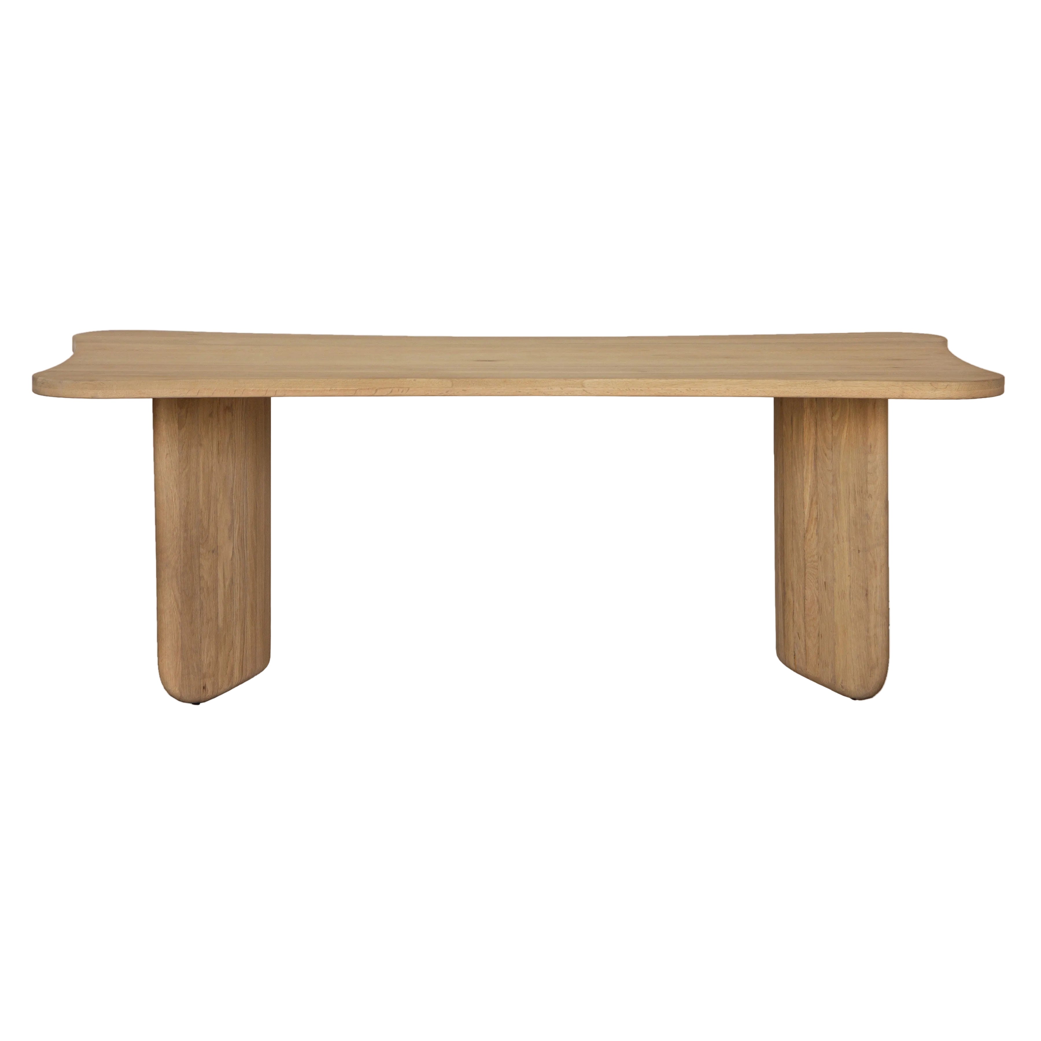 A modern wooden table with a light oak finish, featuring a wavy, asymmetrical top and two thick blocky legs, shown against a plain white background.