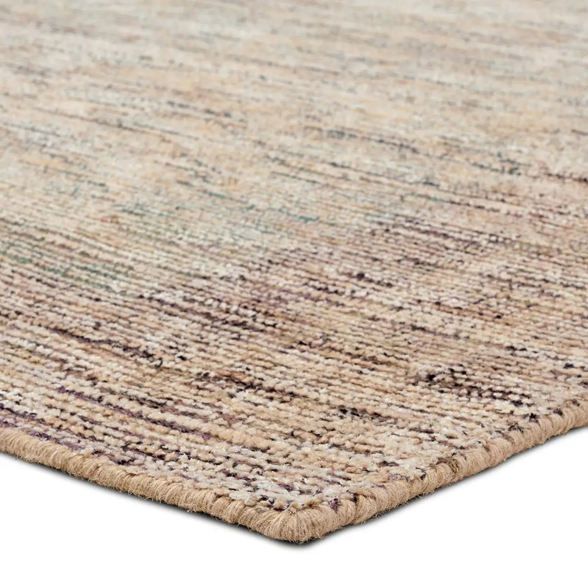 Close-up of a textured beige and brown rug on a white background
