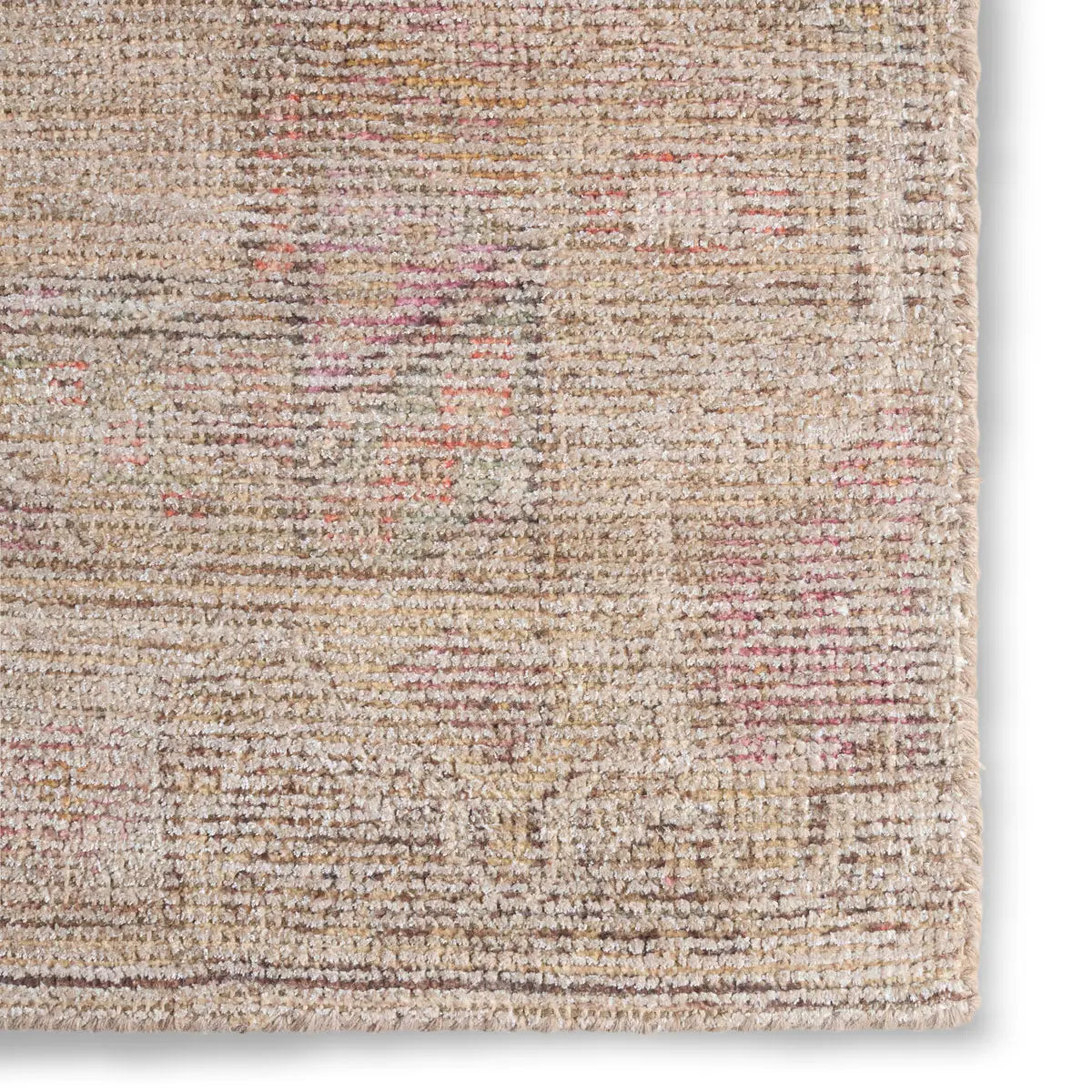 Close-up of a textured beige rug with subtle color variations.