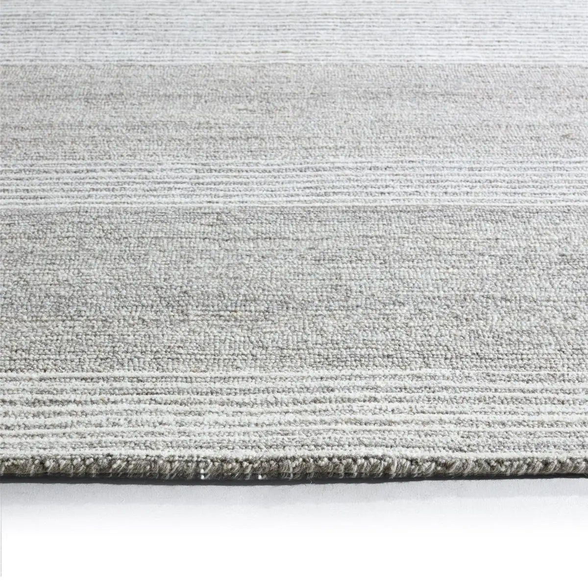 Textured gray rug on a white background