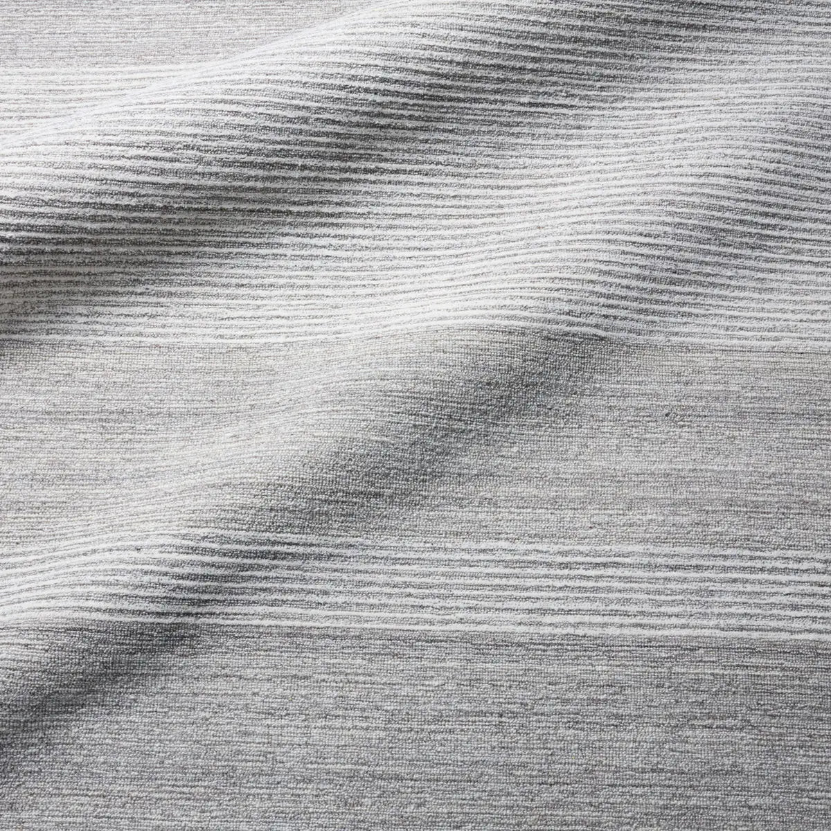 Textured gray surface with brushstroke pattern