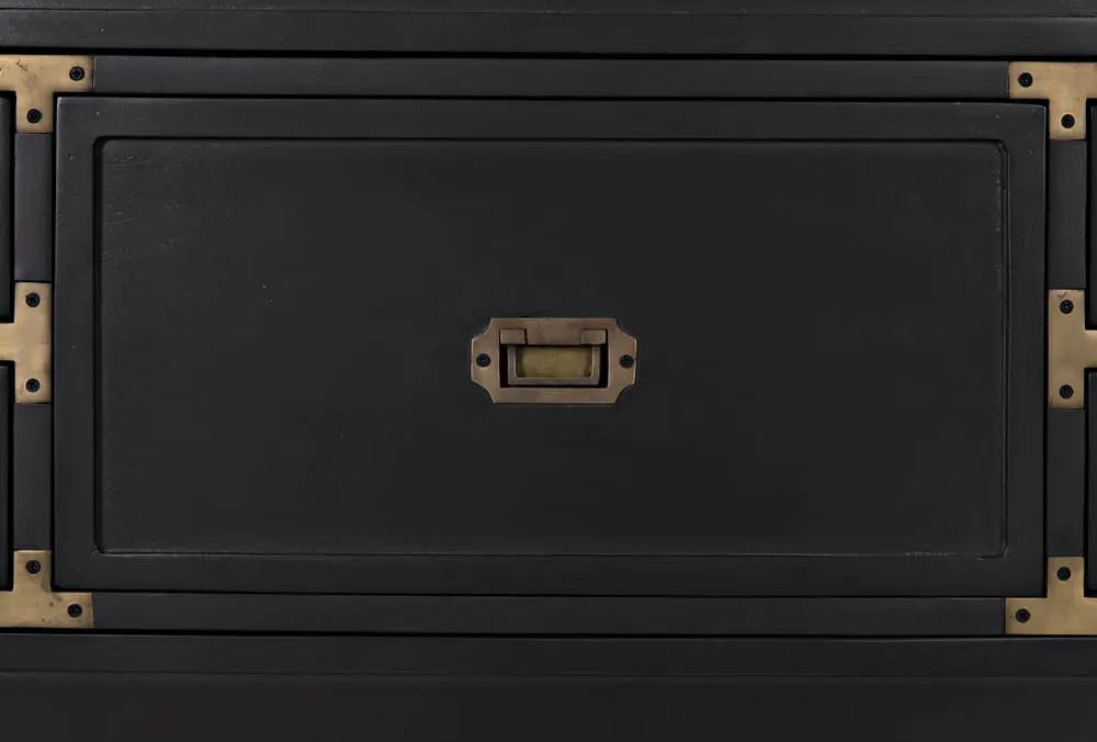 Black mahogany dresser with brass accents on a black background