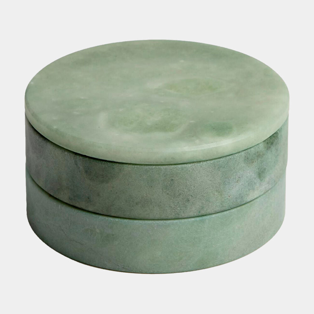 Round green stone box on a white background