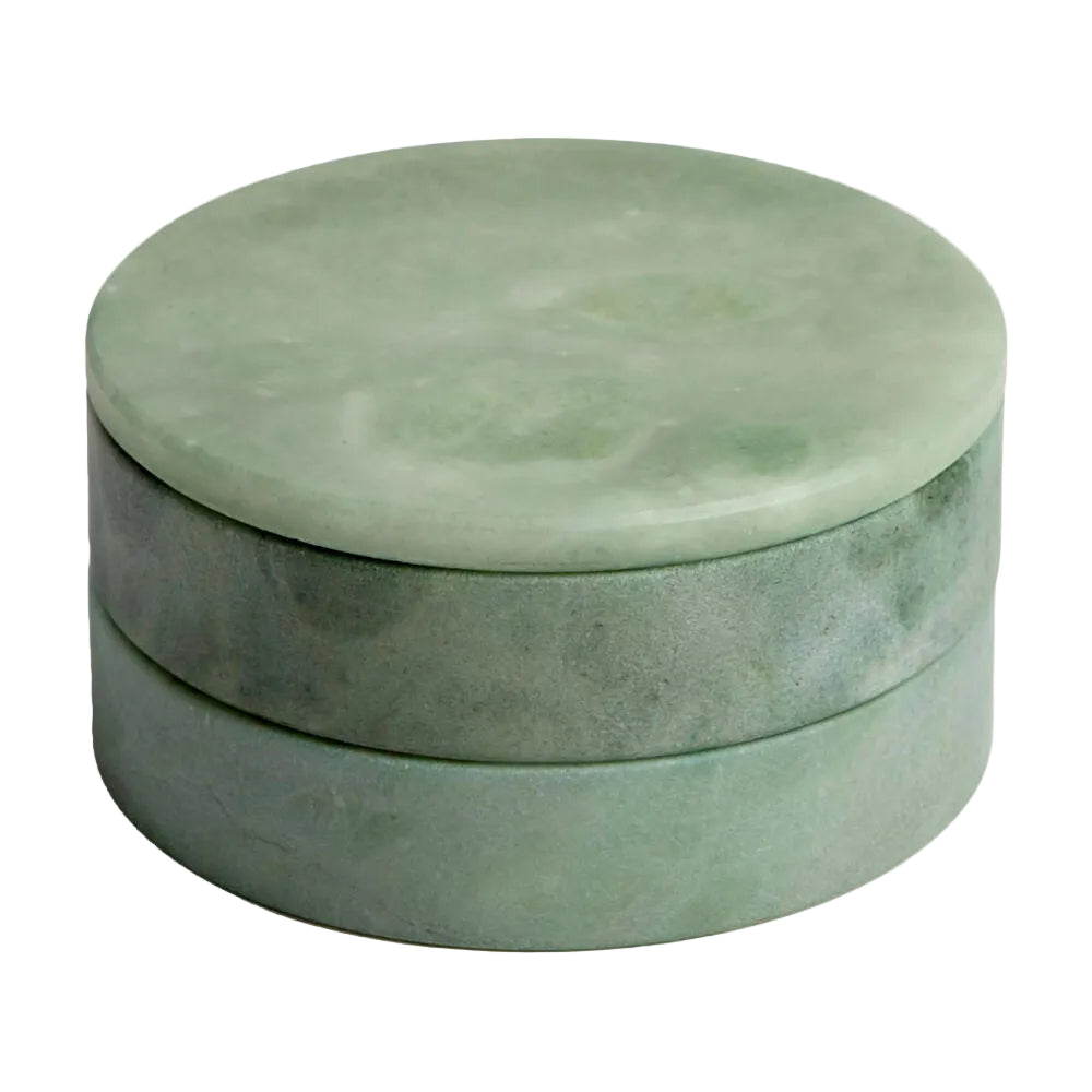 Round green stone box on a white background