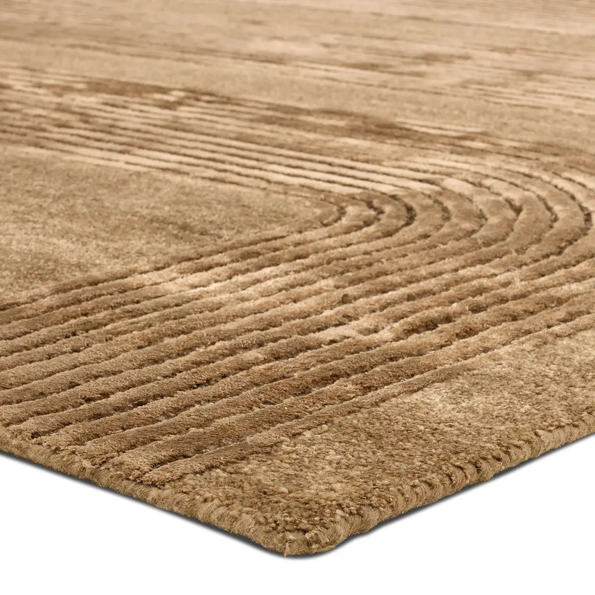 Close-up of a textured brown rug with wavy pattern
