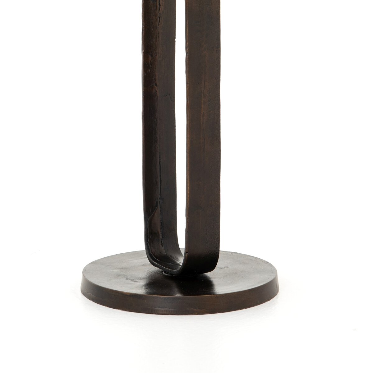 Dark metal stand with a circular base on a white background
