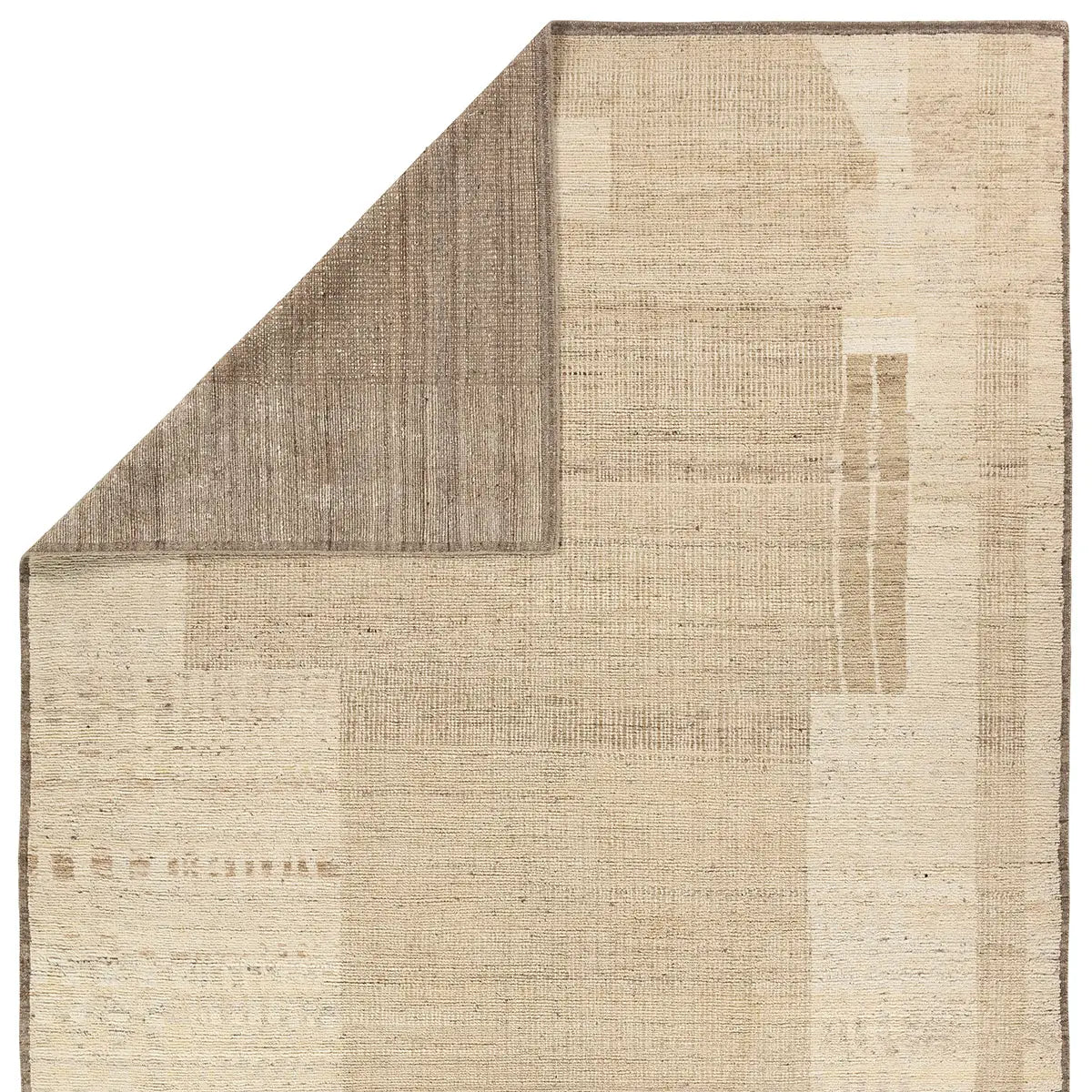 Beige and brown textured rug corner