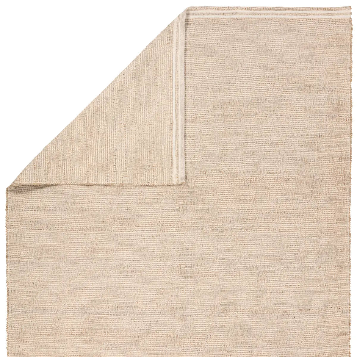 Beige textured rug corner on a white background
