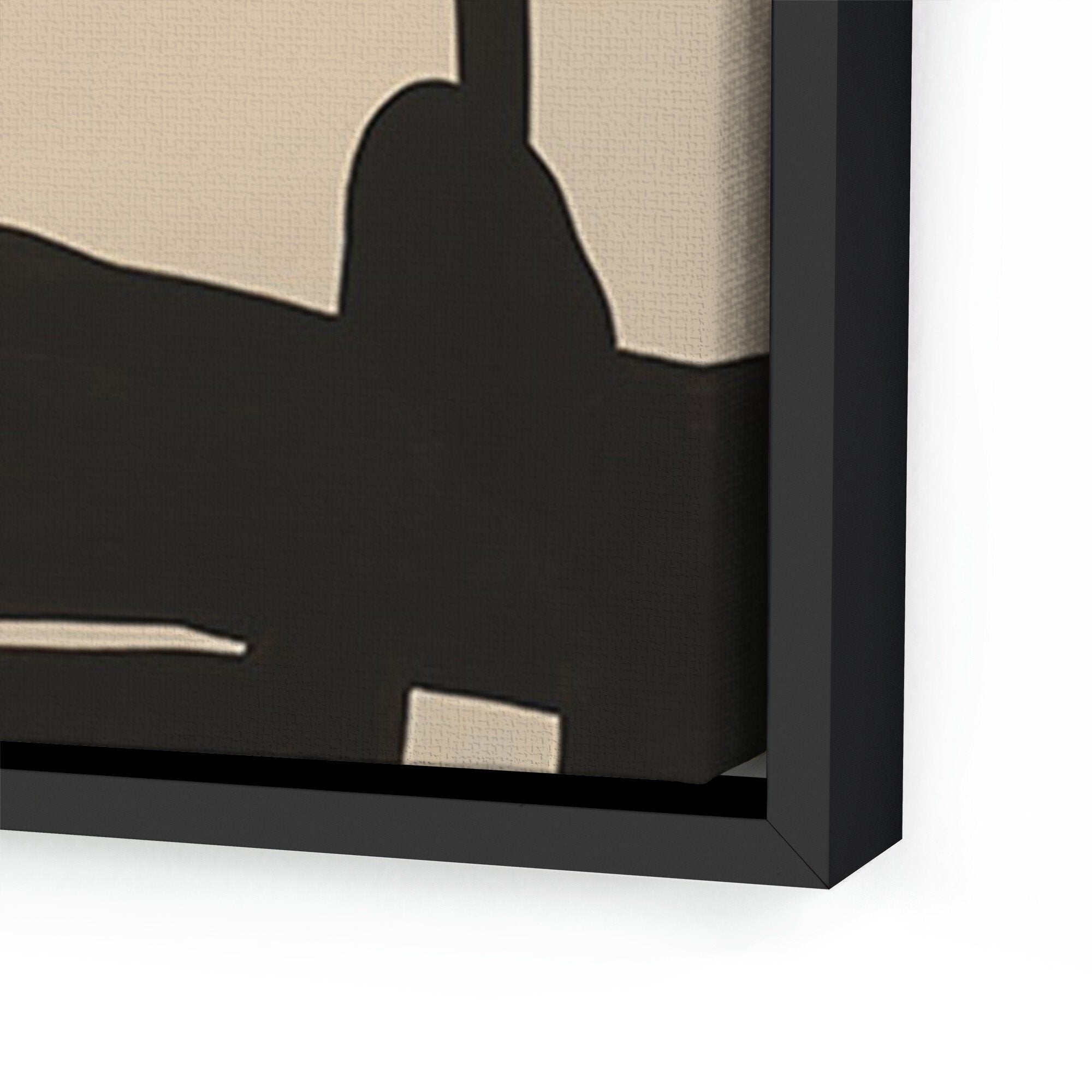 Framed abstract black and beige artwork on a beige background