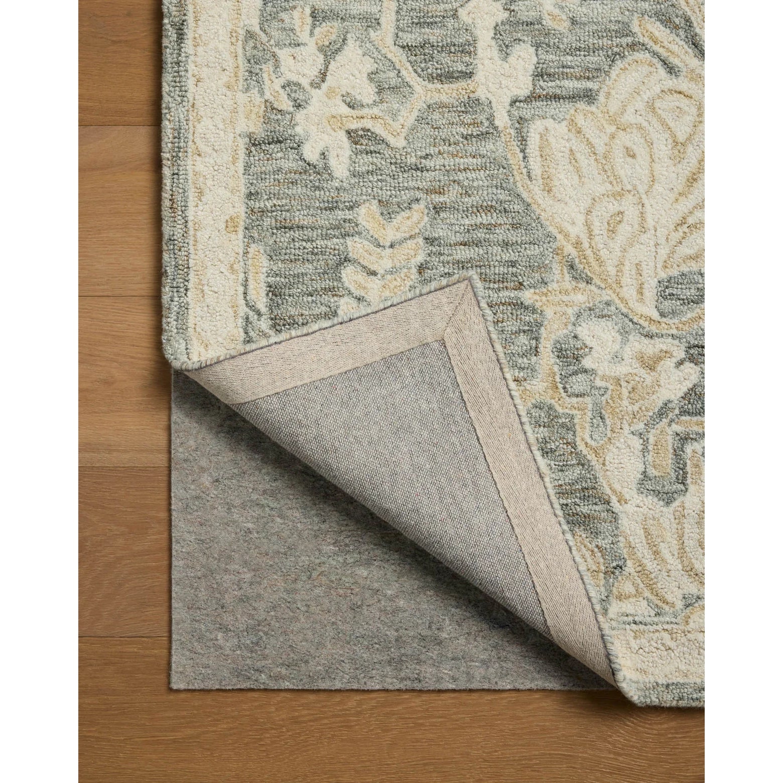 Rug with a floral pattern on a wooden floor