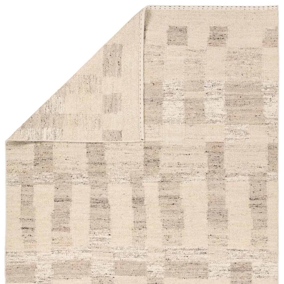 Textured area rug with a geometric pattern on a white background