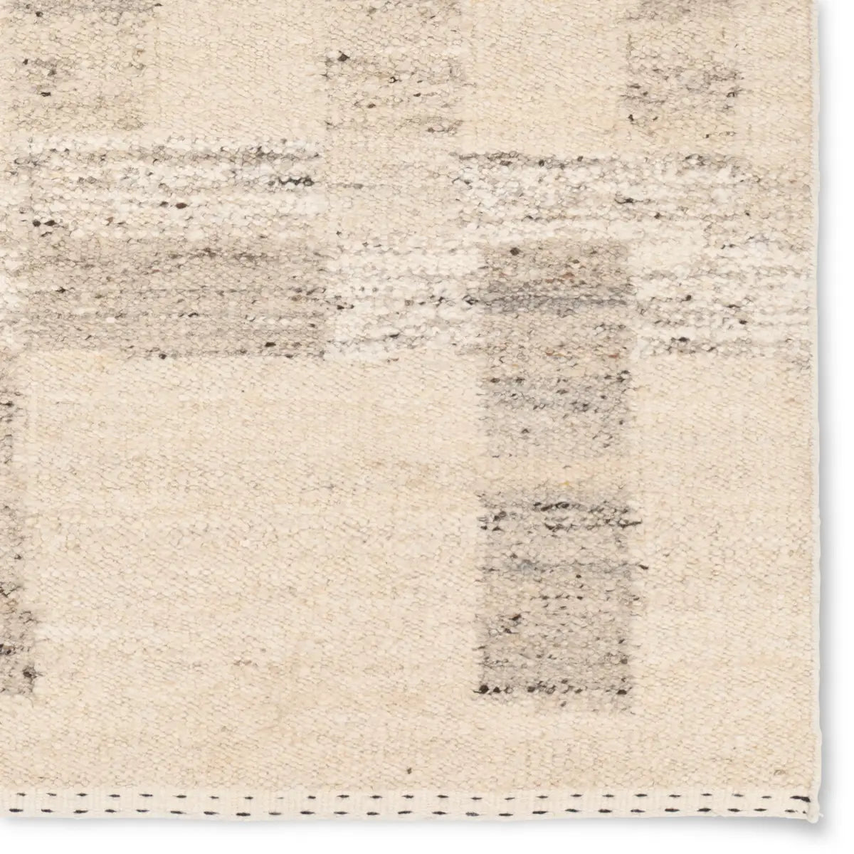 Beige and gray area rug with a subtle pattern