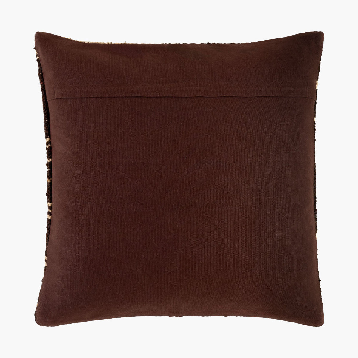 Brown pillow with textured edges on a white background