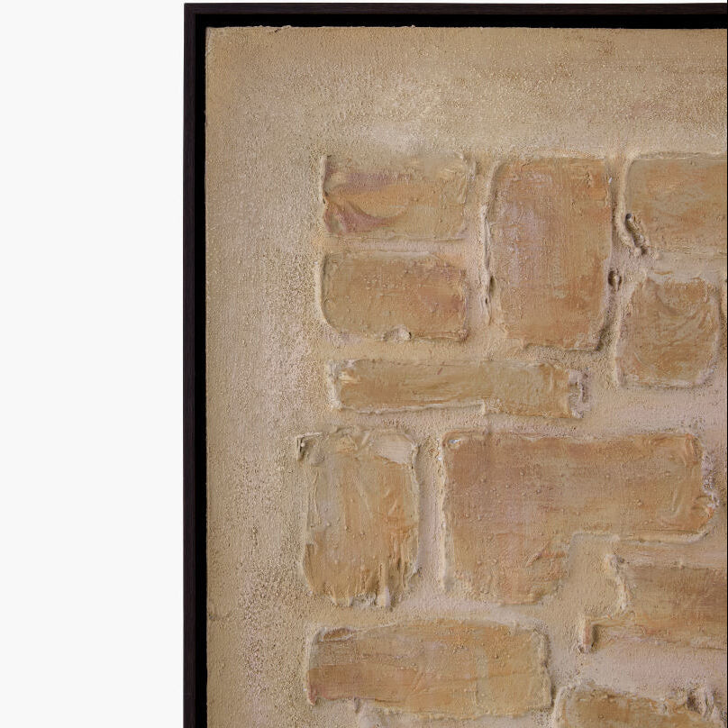 Close-up of a textured beige wall with a black frame.