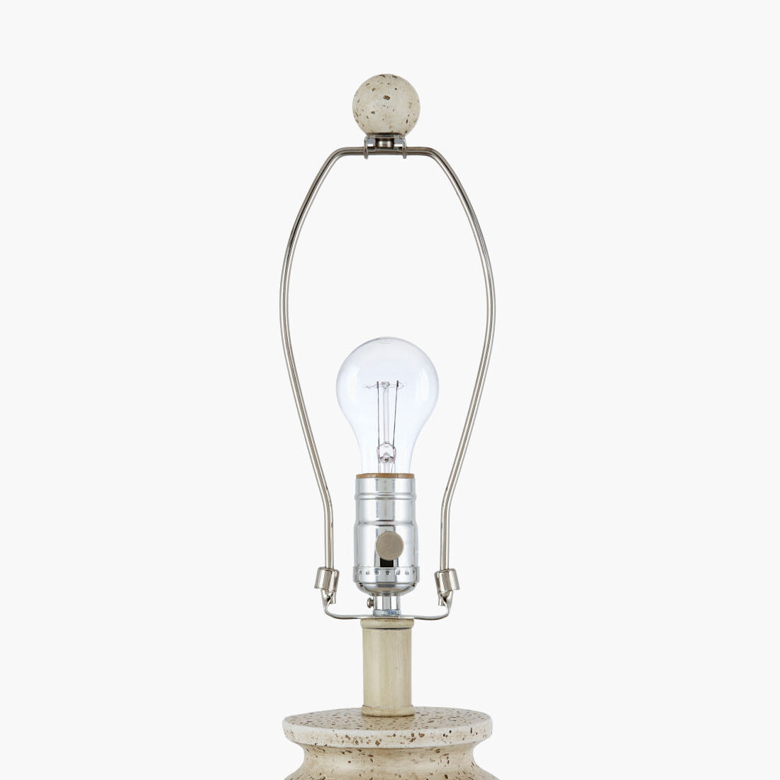 A close-up of a table lamp featuring a round, speckled stone base and finial, a clear glass bulb, and a curved silver metal frame, set against a plain white background.