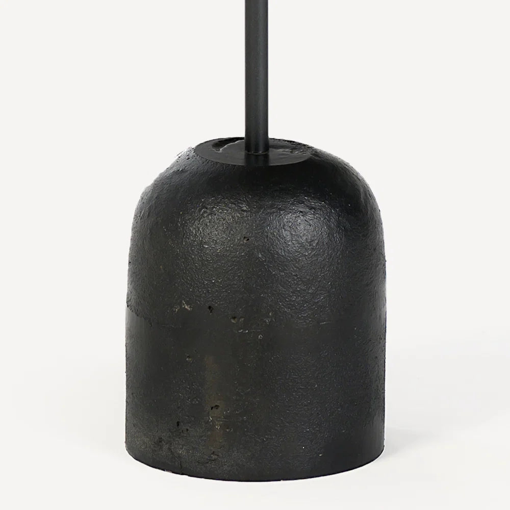 Black metal textured cylindrical table base on a white background