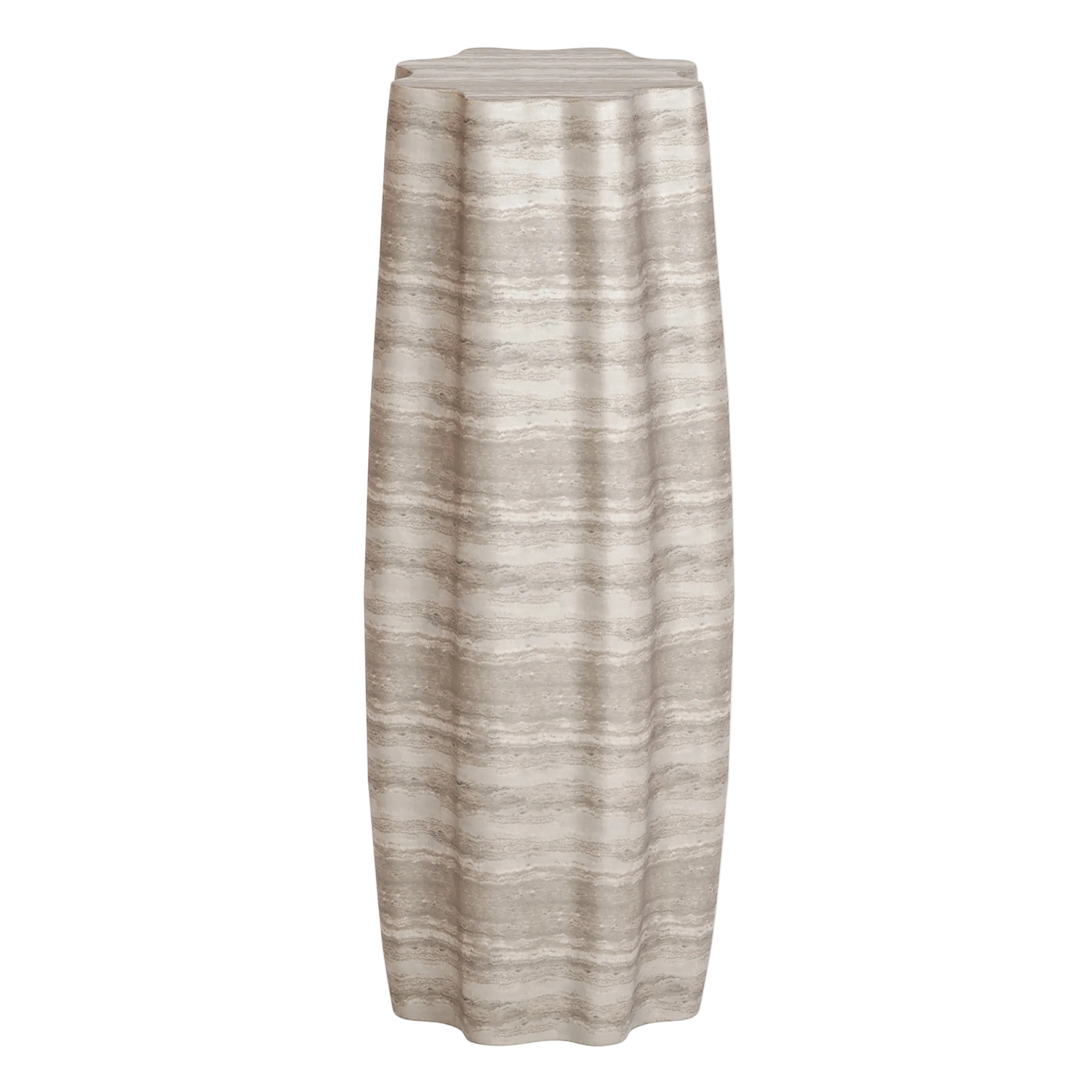 Concrete pedestal side table with travertine finish on white background