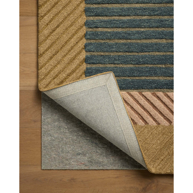 Multicolored striped rug on a wooden floor with a close-up of the rug's corner.