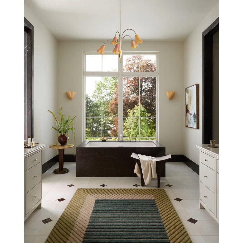 Modern bathroom with a large window, bathtub, and decorative elements.