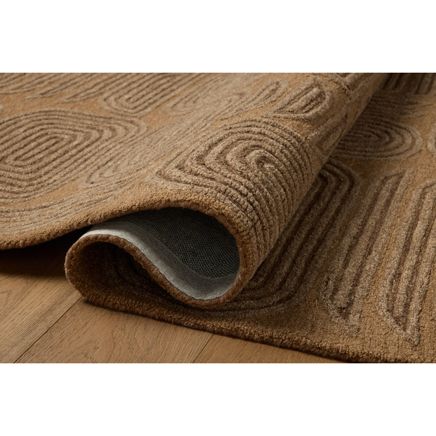 Brown textured rug on a wooden floor