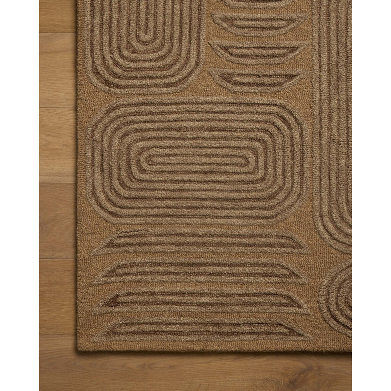 Brown textured rug with geometric pattern on a wooden floor
