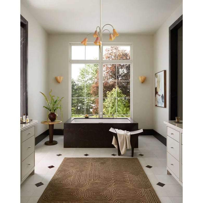 Modern bathroom with a large window, bathtub, and decorative elements.
