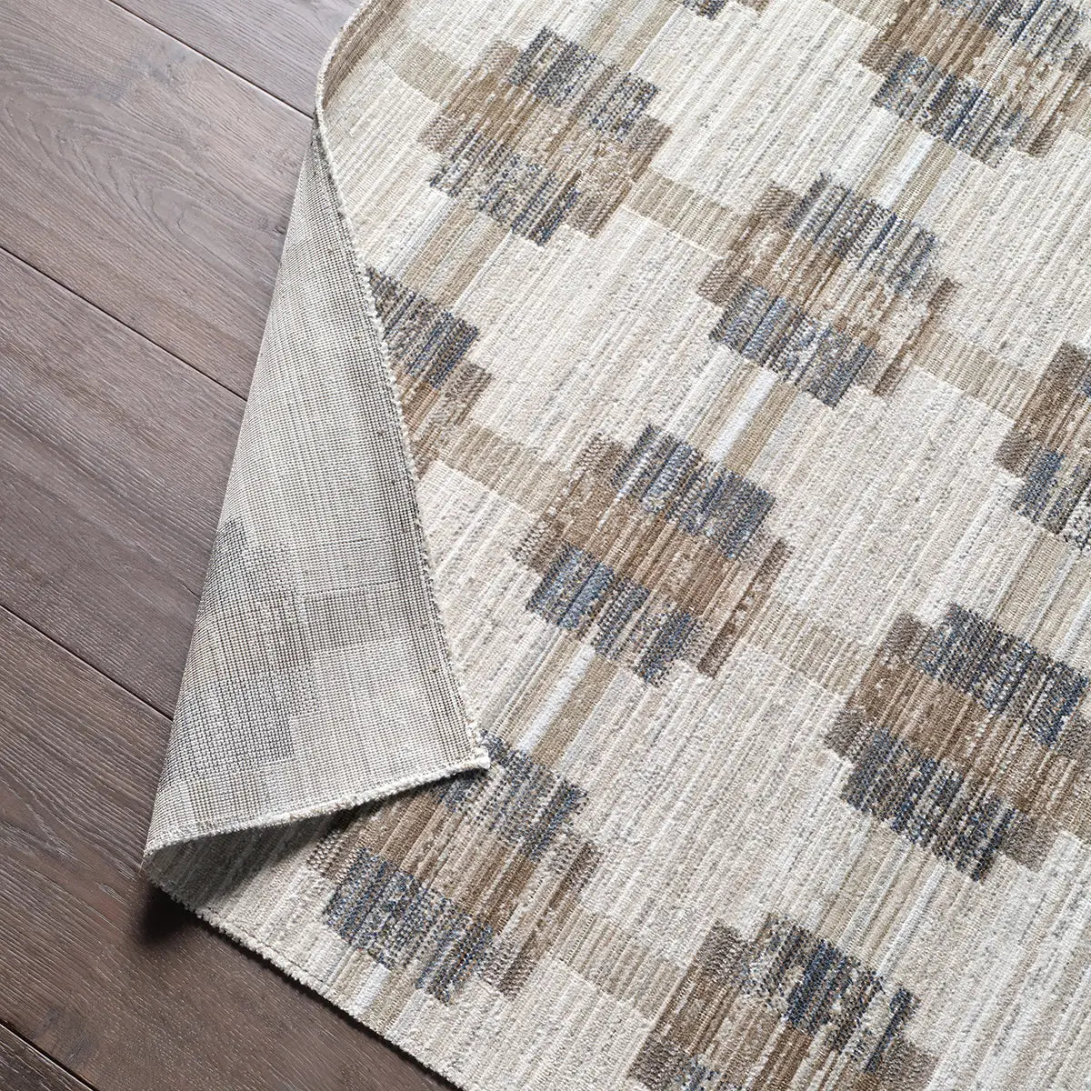 Patterned rug on a wooden floor
