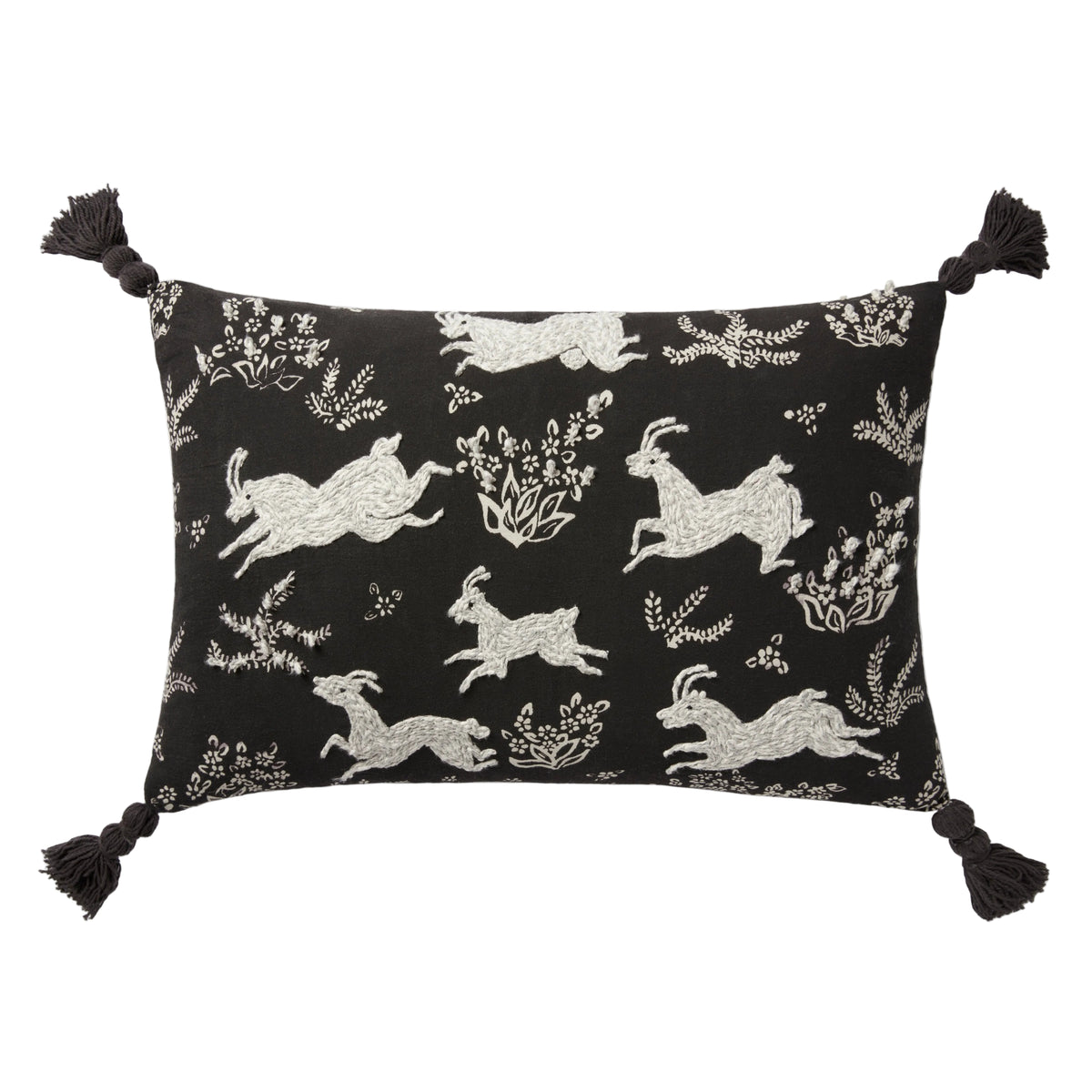 Decorative pillow with black and white animal pattern on a white background