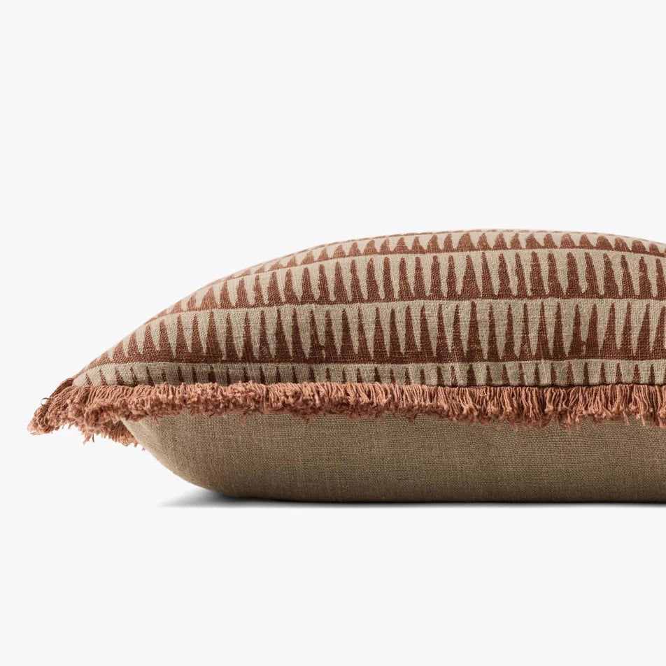 Decorative pillow with brown and beige pattern on a white background