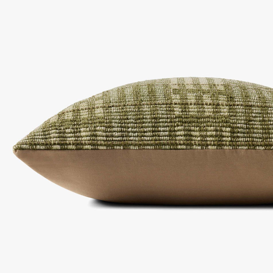 Textured green and brown pillow on a white background